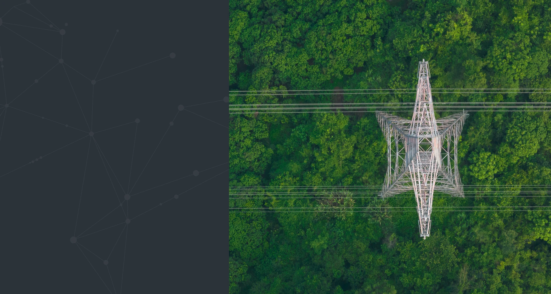 Aerial view of power transmission tower surrounded by green forest